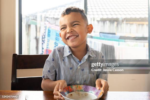 kid smiling enjoying breakfast - auckland food bildbanksfoton och bilder