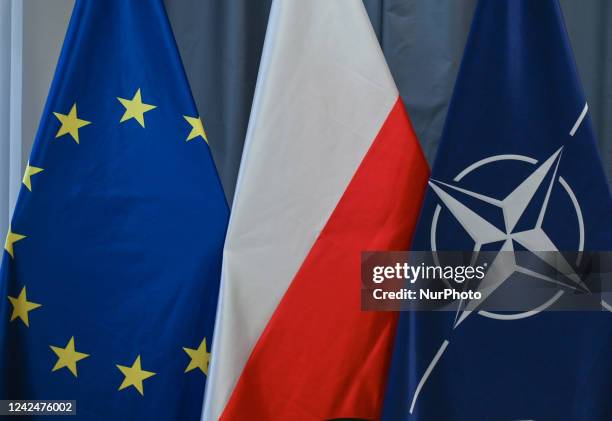 Flags of the European Union, Poland and NATO seen in Krakow. On Thursday, August 11 in Krakow, Lesser Poland Voivodeship, Poland.