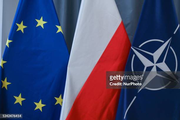 Flags of the European Union, Poland and NATO seen in Krakow. On Thursday, August 11 in Krakow, Lesser Poland Voivodeship, Poland.