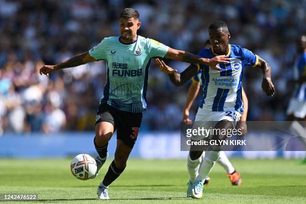 Newcastle United's Brazilian midfielder Bruno Guimaraes vies with Brighton's Ecuadorian midfielder Moises Caicedo during the English Premier League...