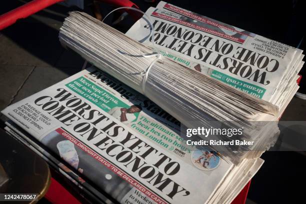 Evening Standard newspapers carry a headline warning the British public that the worst is to come for the UK economy, at Piccadilly Circus...