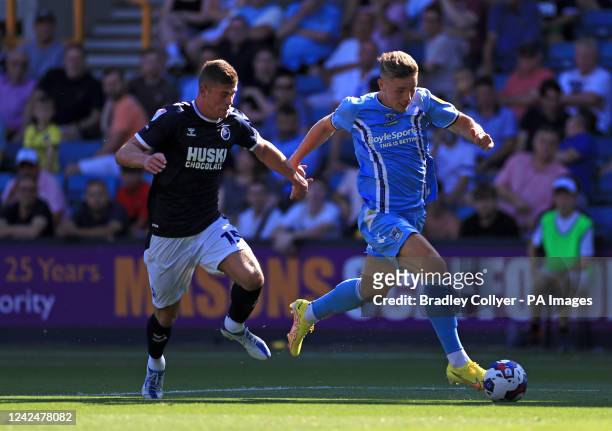 Coventry City's Viktor Gyokeres and Millwall's Charlie Cresswell battle for the ball during the Sky Bet Championship match at The Den, London....