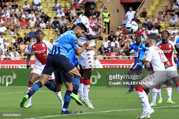 Monaco's French midfielder Soungoutou Magassa fights for the ball with Rennes' French forward Martin Terrier during the French L1 football match...