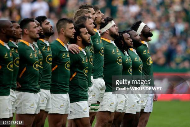 South Africa's flanker and captain Siya Kolisi leads his players as they sign the national anthem ahead of the Rugby Championship international rugby...