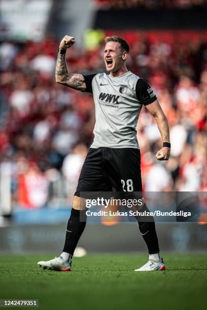 Scorer Andre Hahn of Augsburg celebrates his teams second goal during the Bundesliga match between Bayer 04 Leverkusen and FC Augsburg at BayArena on...