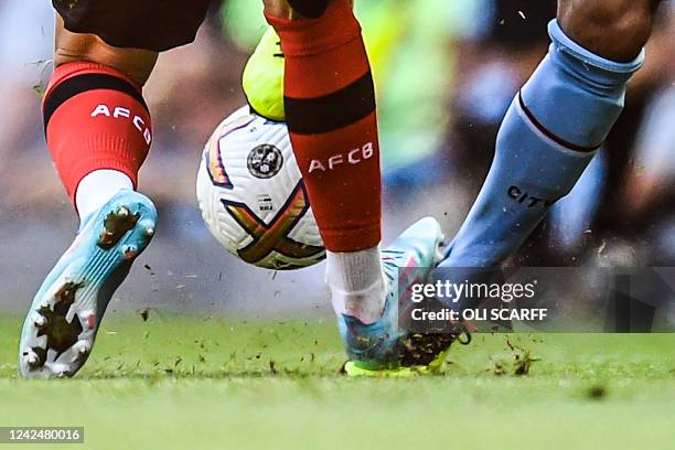 Bournemouth's Scottish midfielder Ryan Christie steps on the foot of Manchester City's German midfielder Ilkay Gundogan during the English Premier...