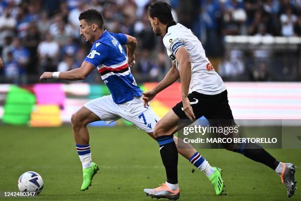 Sampdorias Serbian midfielder Filip Djuricic fights for the ball with Atalantas Brazilian defender Rafael Toloi during the Serie A football match...