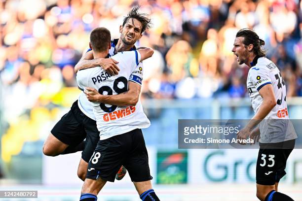 Rafael Tolói of Atalanta celebrates with his team-mates Mario Pasalic and Hans Hateboer after scoring a goal during the Serie A match between UC...
