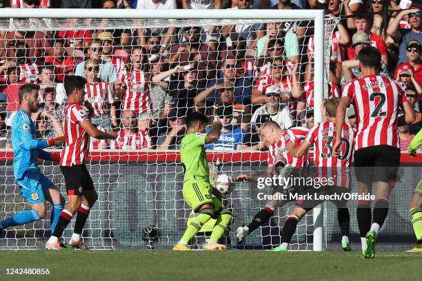 Ben Mee of Brentford scores their team's third goal during the Premier League match between Brentford FC and Manchester United at Brentford Community...