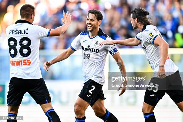 Rafael Tolói of Atalanta celebrates with his team-mates Mario Pasalic and Hans Hateboer after scoring a goal during the Serie A match between UC...