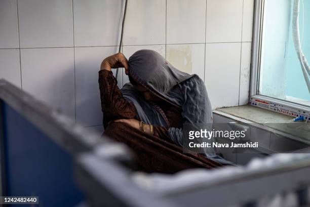 Woman waits on a children’s ward at Indira Gandhi hospital on August 13, 2022 in, 2022 in Kabul, Afghanistan. The collapse of the economy and the...