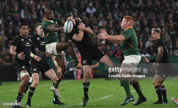 Makazole Mapimpi of South Africa fights for ball possession during The Rugby Championship match between South Africa and New Zealand at Emirates...