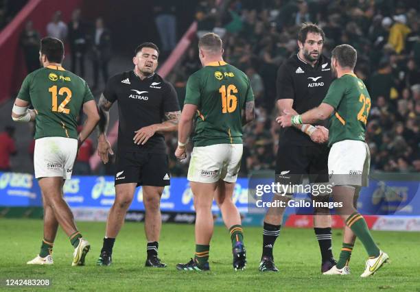 New Zealand and South African players shake hands as the match ends with the former winning during The Rugby Championship match between South Africa...