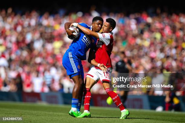 Gabriel Martinelli of Arsenal is fouled by Wesley Fofana of Leicester City who then holds the ball from him during the Premier League match between...