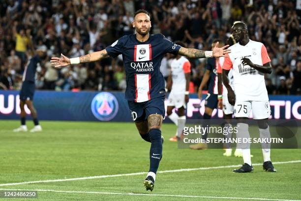 Paris Saint-Germain's Brazilian forward Neymar celebrates after scoring a goal during the French L1 football match between Paris-Saint Germain and...