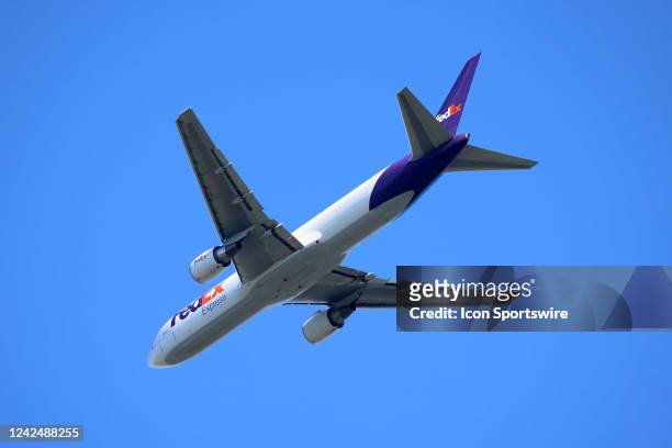 FedEx plane flies over the course during the third round of the FedEx St. Jude Championship on August 13, 2022 at TPC Southwind in Memphis, Tennessee.