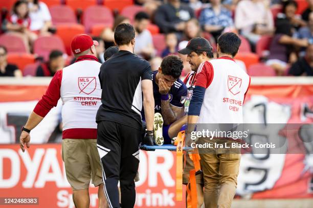 Alexandre Pato of Orlando City SC reacts to being taken off in a stretcher in the first half of the Major League Soccer match against New York Red...