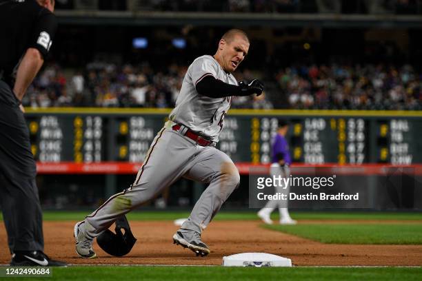 Daulton Varsho of the Arizona Diamondbacks rounds third base as he completes an in an inside-the-park home run against the Colorado Rockies in the...