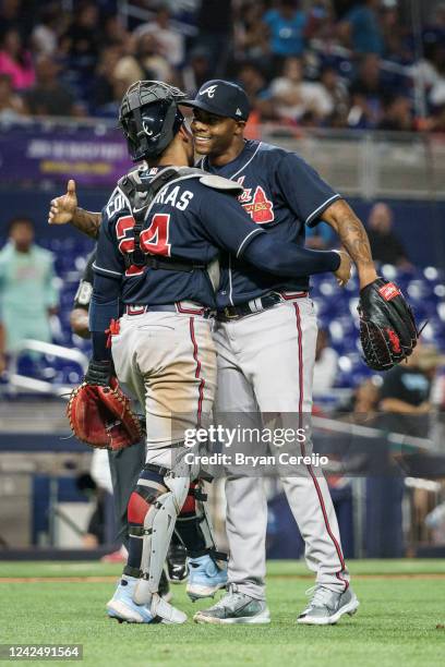William Contreras and Raisel Iglesias of the Atlanta Braves celebrate a 6-2 win against the Miami Marlins at loanDepot park on August 13, 2022 in...