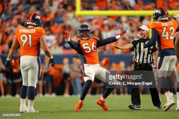 Baron Browning of the Denver Broncos celebrates a sack against the Dallas Cowboys during the second quarter at Empower Field At Mile High on August...