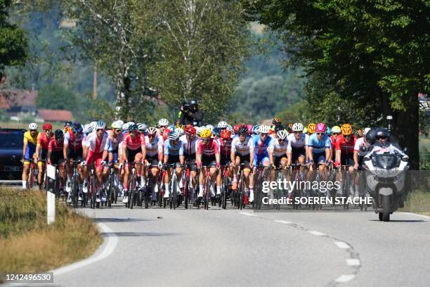 Athletes compete during the men's road race cycling event of the European Cycling Championships on August 14 with the 209,4 km long route going from...