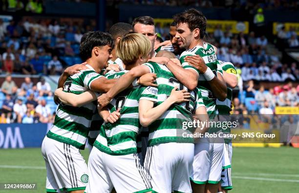 Celtic's Kyogo Furuhashi celebrates scoring to make it 1-0 with his teammates during a cinch Premiership match between Kilmarnock and Celtic at Rugby...