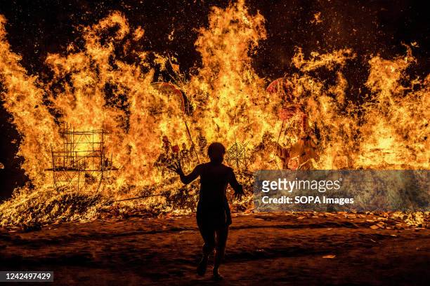 Malaysian Chinese people burn a giant paper statue of the Chinese deity "Da Shi Ye" or "Guardian God of Ghosts" during the Chinese Hungry Ghost...