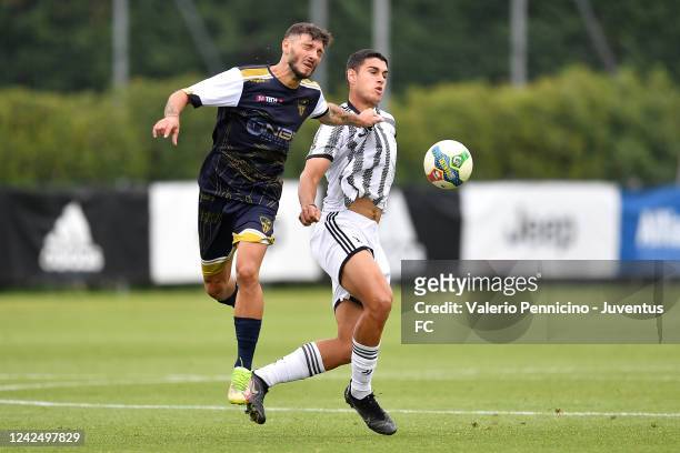Diego Stramaccioni of Juventus U23 is challenged during a Training Session at Juventus Center Vinovo on August 14, 2022 in Vinovo, Italy.
