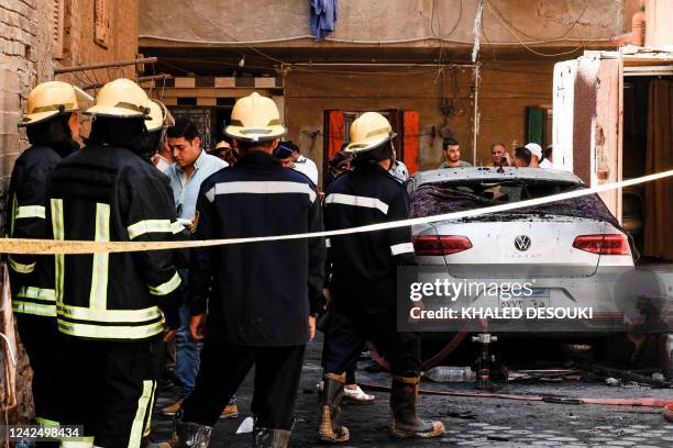 Egyptian firefighters are pictured outside the Abu Sifin church located in the densely populated Imbaba neighbourhood west of the Nile river, part of...