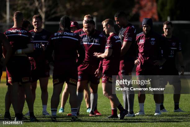 Daly Cherry-Evans of the Sea Eagles and team mates talk during a Manly Sea Eagles training session at the Sydney Academy of Sport on June 03, 2020 in...