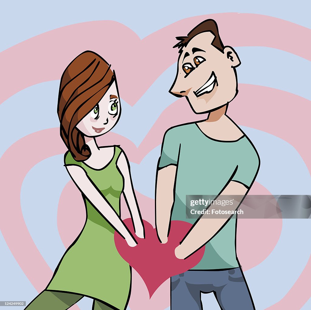 Young couple with their hands in a heart