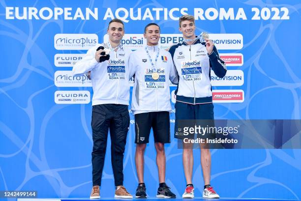 Kristof Milak of Hungary, David Popovici of Romania and Alessandro Miressi of Italy show the medal after compete in the 100m freestyle Men Final...