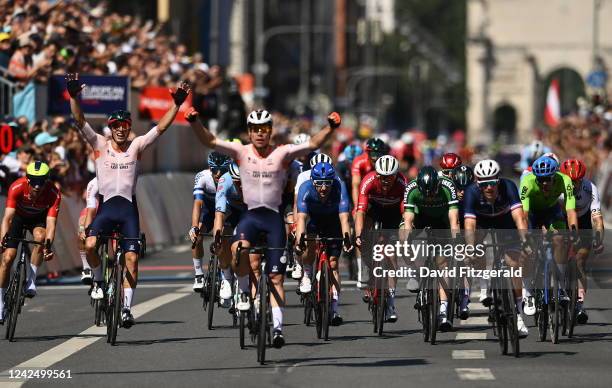 Bavaria , Germany - 14 August 2022; Sam Bennett of Ireland crosses the line in fifth place as Fabio Jakobsen of Netherlands celebrates winning during...