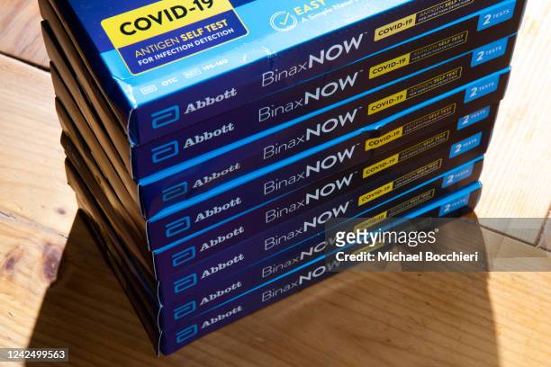 In this photo illustration, boxes of BinaxNow a COVID-19 at home test kit made by Abbott is seen on August 13, 2022 in North Haledon, New Jersey. The...