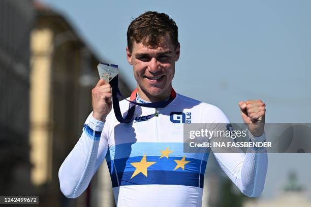 Winner Netherlands' Fabio Jakobsen celebrates on the podium with his gold medal after the men's road race cycling event of the European Championships...