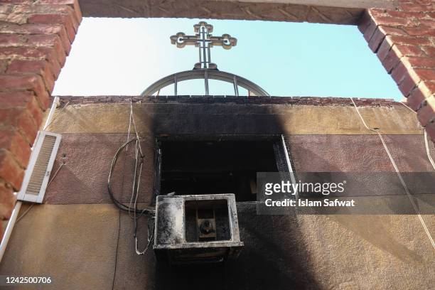 Damage is seen after a fire tore through a Coptic Christian church on August 14, 2022 in the Imbaba neighborhood of Giza, Egypt. More than 40 people...