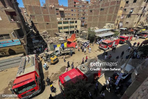 Civil protection personnel work at the scene after a fire tore through a Coptic Christian church on August 14, 2022 in the Imbaba neighborhood of...