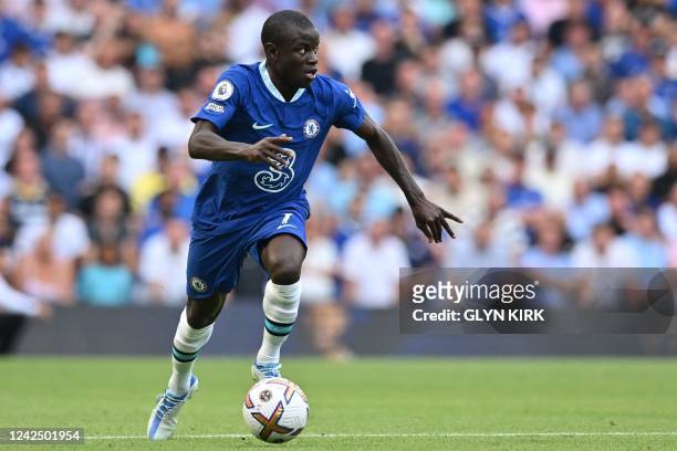Chelsea's French midfielder N'Golo Kante runs with the ball during the English Premier League football match between Chelsea and Tottenham Hotspur at...