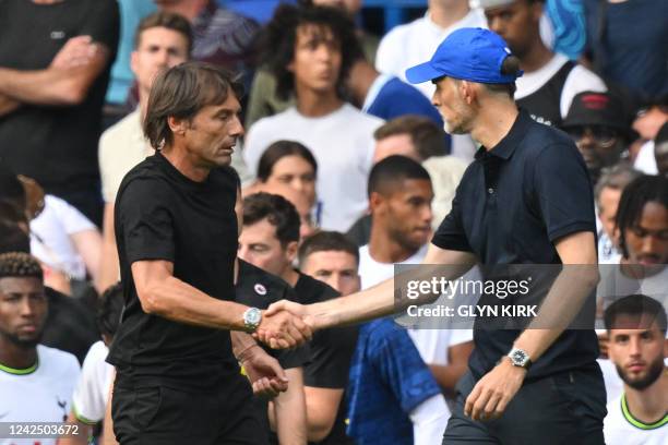 Tottenham Hotspur's Italian head coach Antonio Conte and Chelsea's German head coach Thomas Tuchel shake hands after the English Premier League...