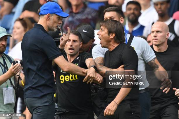 Tottenham Hotspur's Italian head coach Antonio Conte and Chelsea's German head coach Thomas Tuchel shake hands then clash after the English Premier...