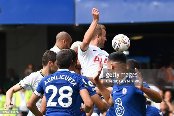 Tottenham Hotspur's English striker Harry Kane heads home their late second goal during the English Premier League football match between Chelsea and...