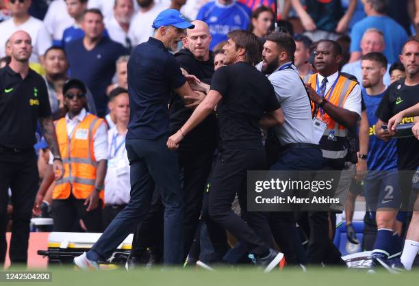 Chelsea Head Coach Thomas Tuchel and Tottenham Hotspur Head Coach Antonio Conte clash after the Premier League match between Chelsea FC and Tottenham...