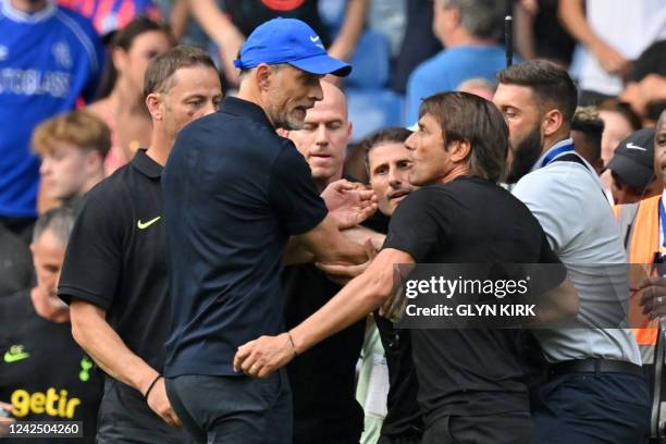 Tottenham Hotspur's Italian head coach Antonio Conte and Chelsea's German head coach Thomas Tuchel clash after the English Premier League football...