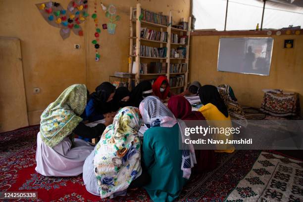 Girls attend class at a secret school on August 14, 2022 in Kabul, Afghanistan. Secondary education for girls has been banned since shortly after the...