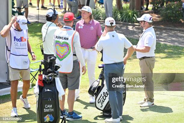 Cameron Smith of Australia stands near the starting tent on the first tee box during the final round of the FedEx St. Jude Championship at TPC...