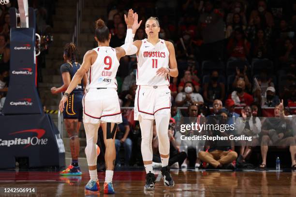 Elena Delle Donne of the Washington Mystics high fives team mate during the game against the Indiana Fever on August 14, 2022 at Entertainment &...