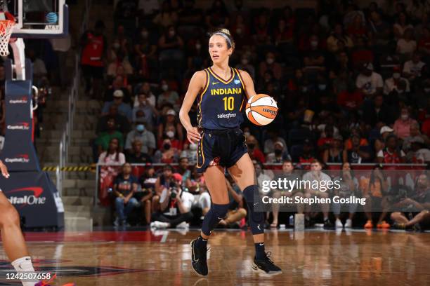 Lexie Hull of the Indiana Fever handles the ball during the game against the Washington Mystics on August 14, 2022 at Entertainment & Sports Arena in...