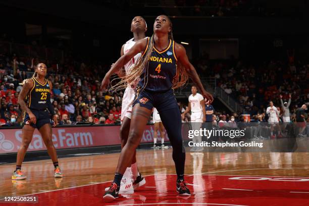 Queen Egbo of the Indiana Fever defends the ball during the game against the Washington Mystics on August 14, 2022 at Entertainment & Sports Arena in...