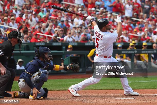 Albert Pujols of the St. Louis Cardinals hits his second home run of the game, a three-run shot, against the Milwaukee Brewers in the eighth inning...