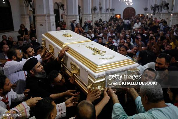 Egyptian mourners attend the funeral of victims killed in Cairo Coptic church fire, at the church of the Blessed Virgin Mary in Imbaba district of...